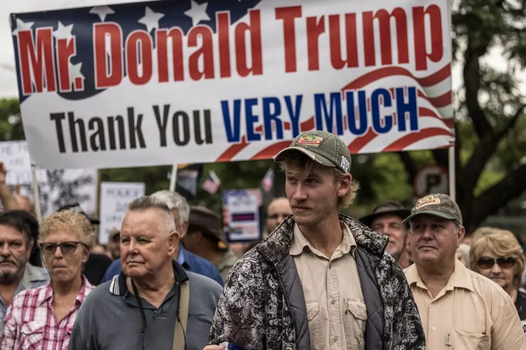 ‘They’re White and Racist Like Trump’: Donald Trump Fast-Tracks Afrikaner ‘Refugees’ Citing False Genocide But White South African Journalist Says Their Real Fear Is Equality, Not Violence