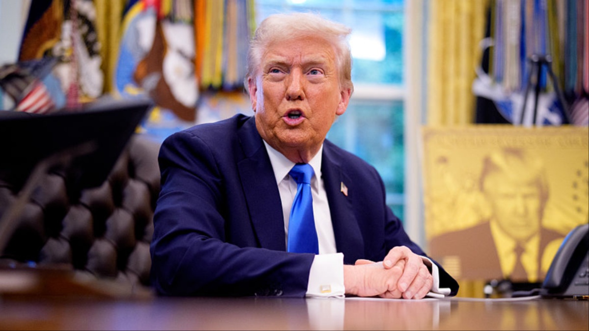 ‘Who Is That On the Floor?!’: Trump Sparks Uproar After Photos Capture Him Signing His Own Tweets — Then Viewers Zoom In and Spot Something Even Worse