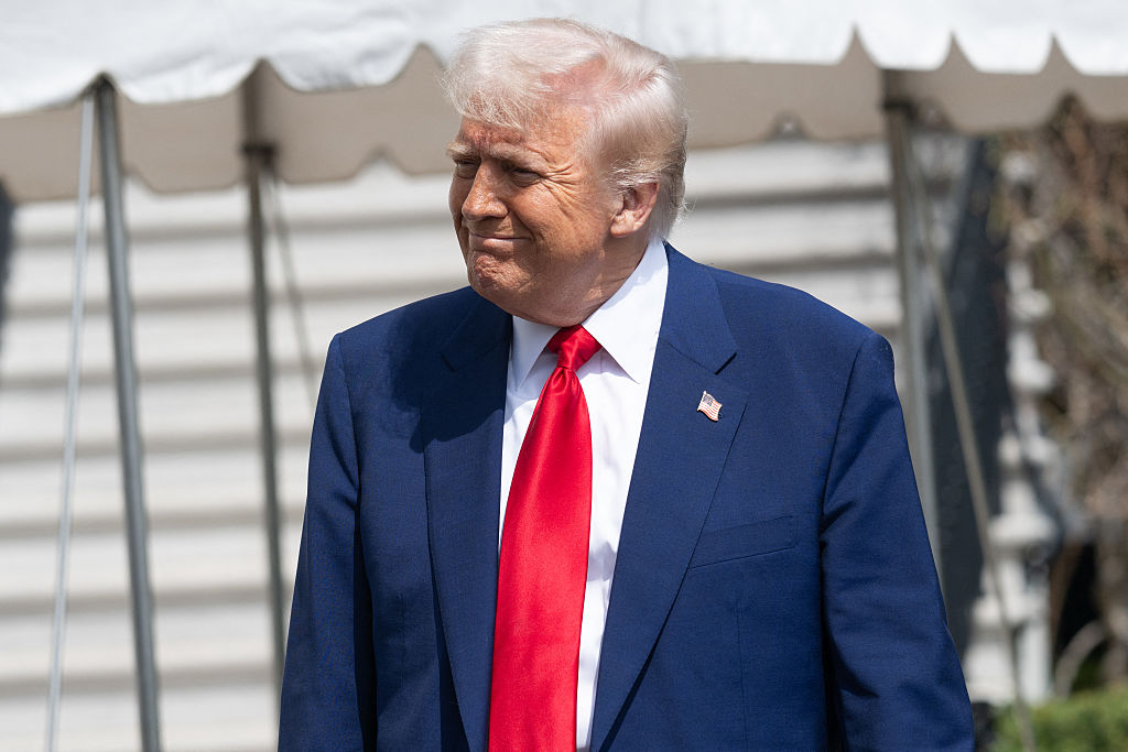 ‘Two Nurses Nearby?’: Trump Soaks Up Applause at His Golf Resort — But the Woman Trailing Him With That Bag Is What Everyone Can’t Stop Talking About