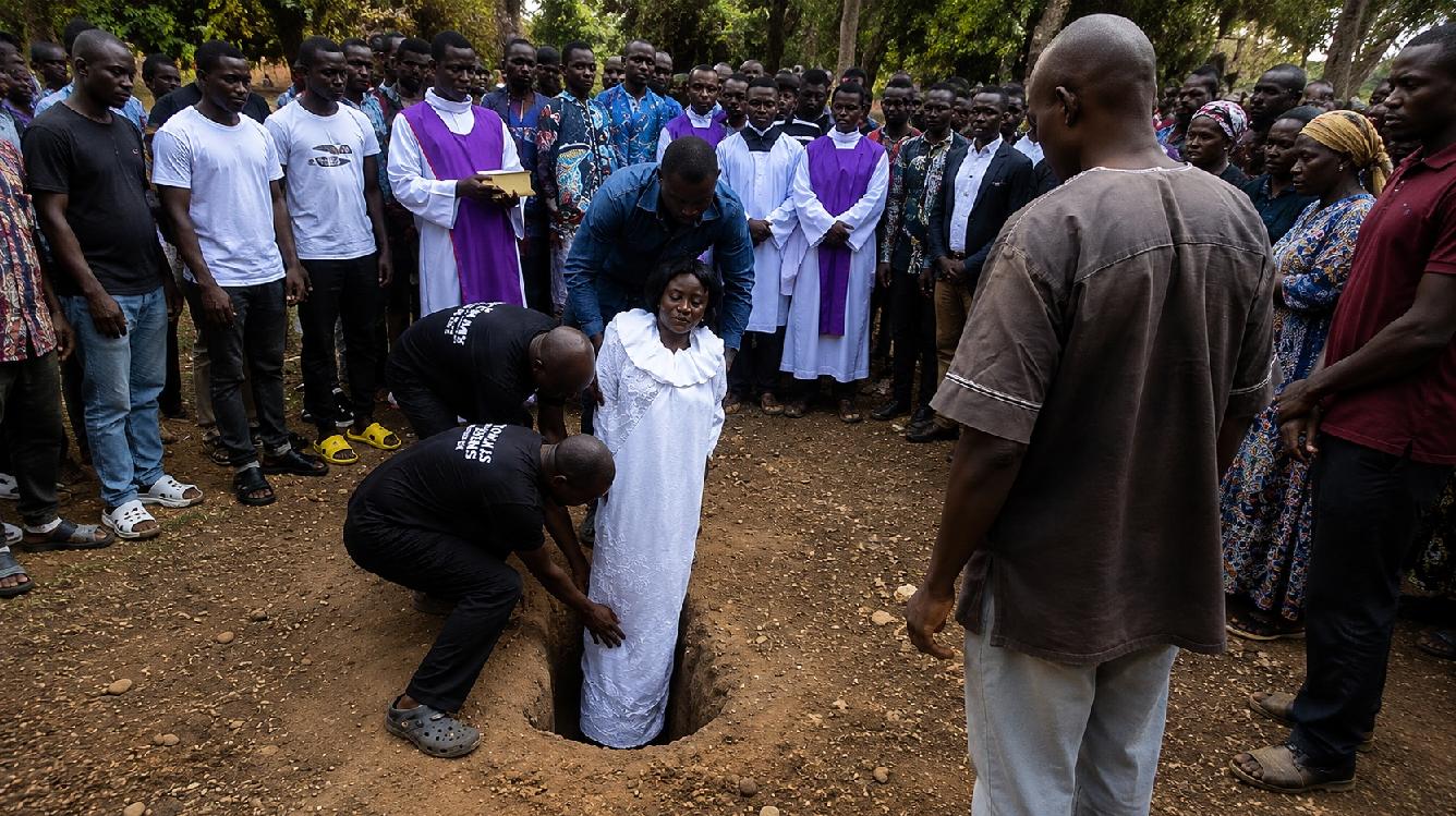 Video Shows Woman Buried Completely Upright in Striking Funeral Rite | WATCH