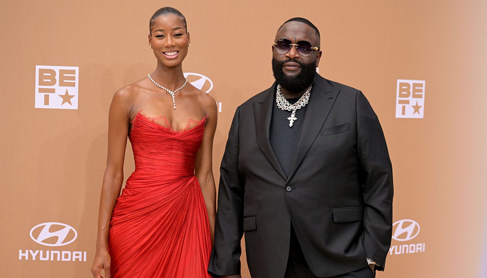 Rick Ross’ Girlfriend Accuses Him Of Physical Assault, Shares Photos Of Proof: ‘He Saw A Punching Bag’
